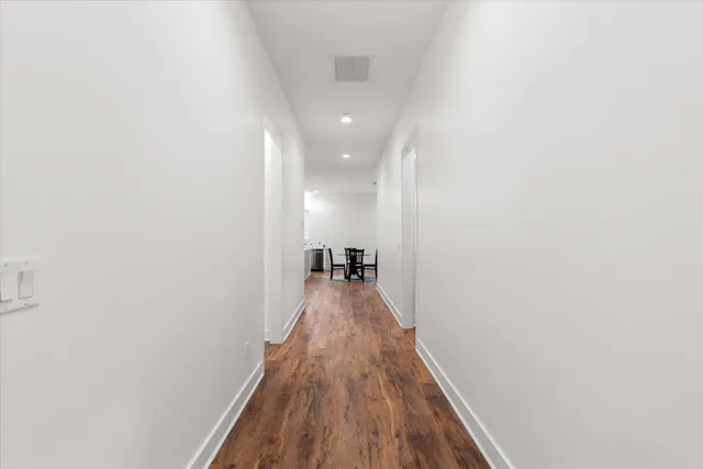 a bathroom with a granite countertop sink mirror and shower