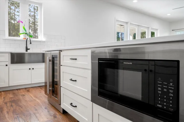 a view of backyard of house with green space