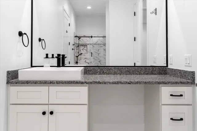 a view of a field with trees in the background