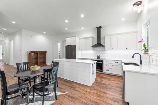 a view of walk in closet with clothes