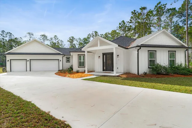 an aerial view of a house with pool