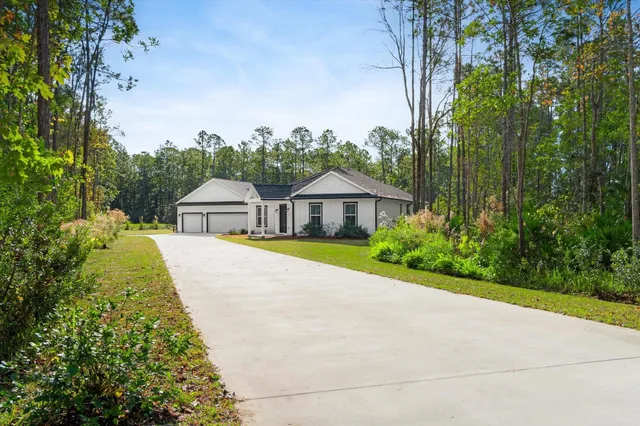 a kitchen with a table chairs sink and cabinets