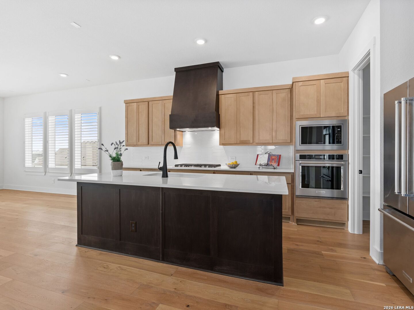 241 Sentido Boerne, TX 78006 - Photo 14 of 53 a kitchen with stainless steel appliances granite countertop a refrigerator and a sink