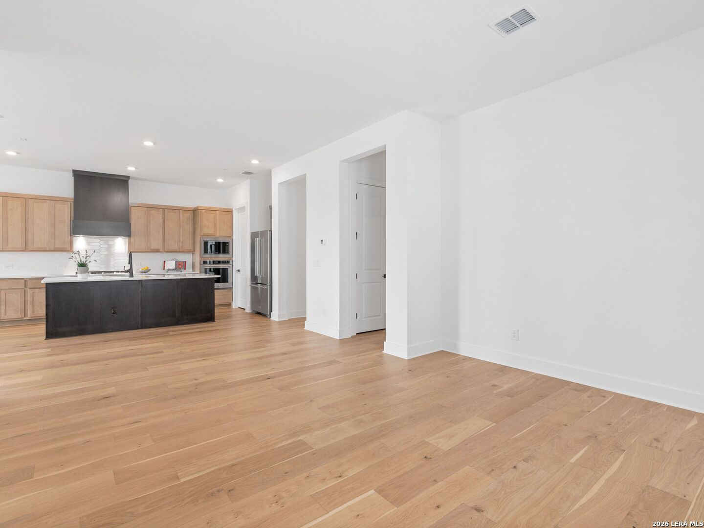 241 Sentido Boerne, TX 78006 - Photo 18 of 53 a view of a kitchen with a sink and a refrigerator