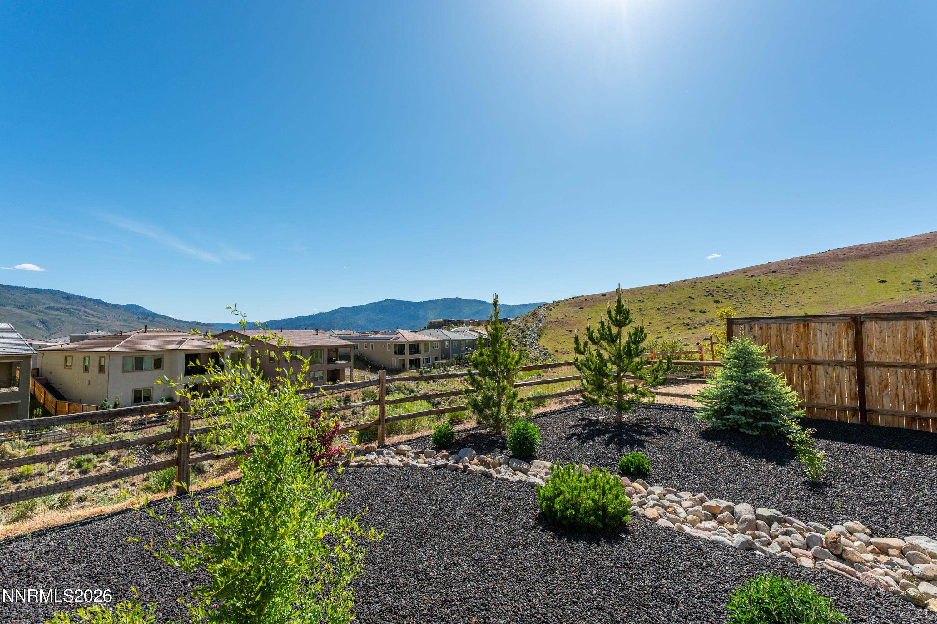 9028 Iron Sky Court Reno, NV 89523 - Photo 36 of 36 a view of a garden with a building in the background