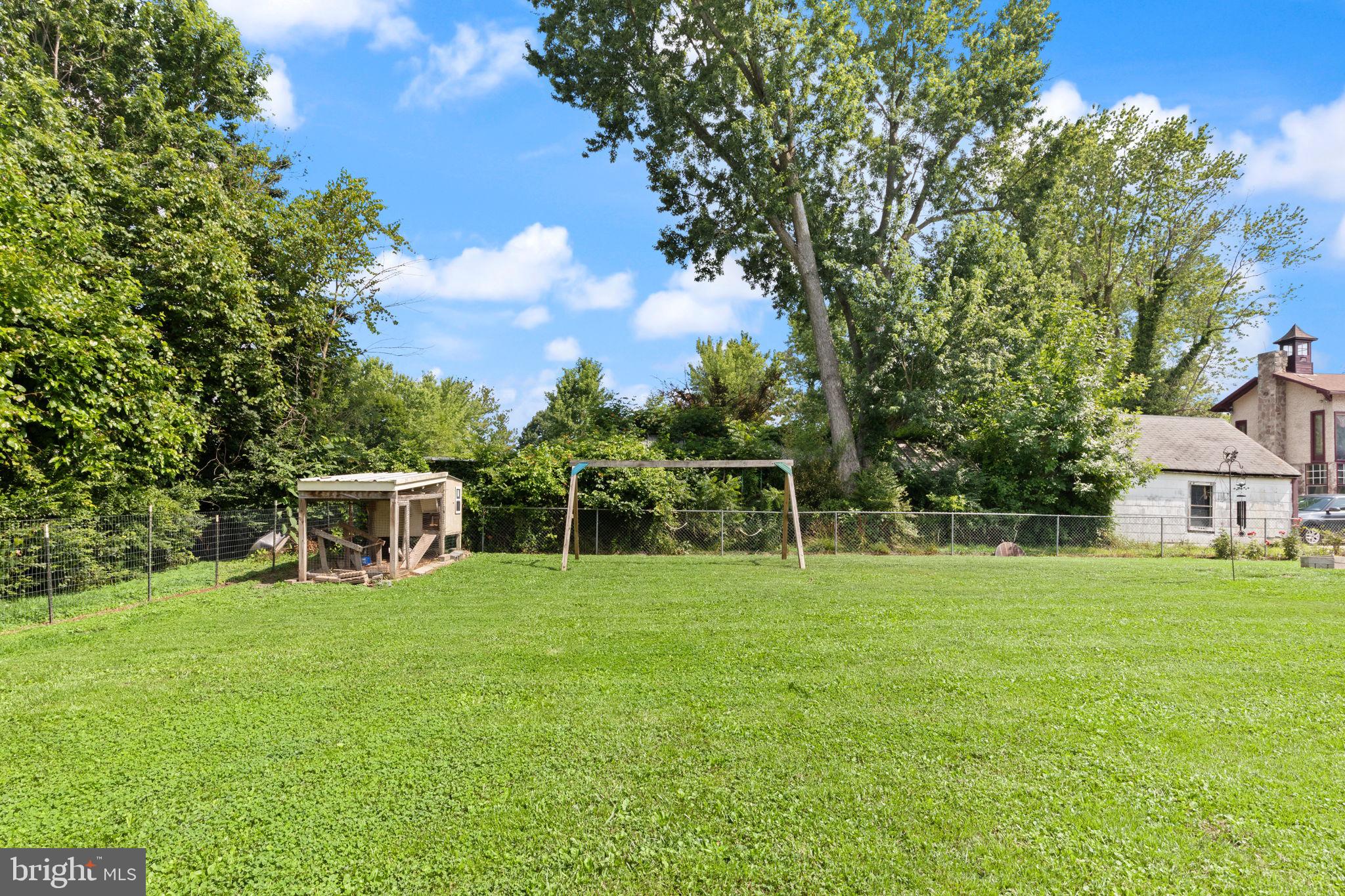 105 Mechanics Valley Road North East, MD 21901 - Photo 29 of 34 Spacious yard w/ lush greenery and a chicken coop.