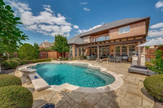 a view of a swimming pool with a patio