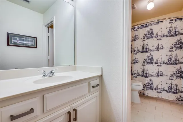 a bedroom with bed and a window