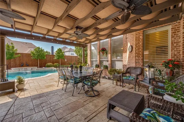a building outdoor space with patio furniture and potted plants