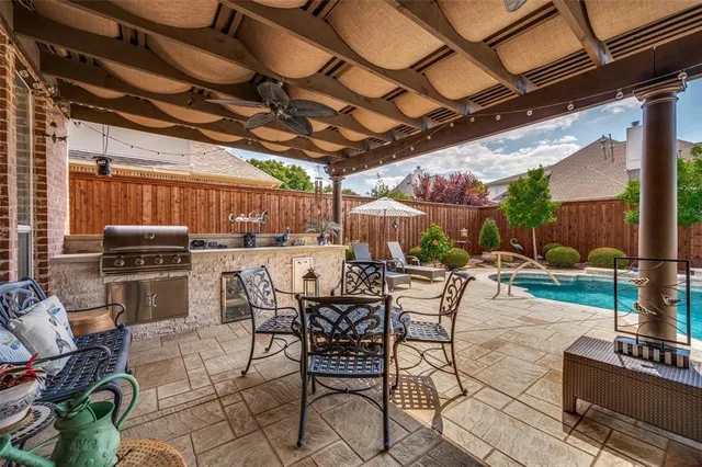 a view of a backyard with a sitting area