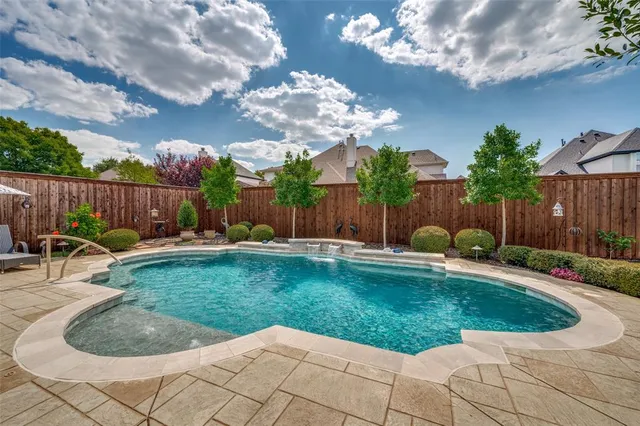 a house with lots of trees in the background
