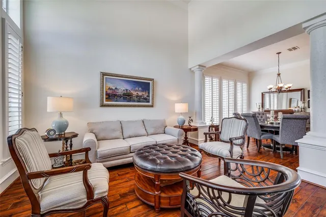 a living room with furniture a rug and a window