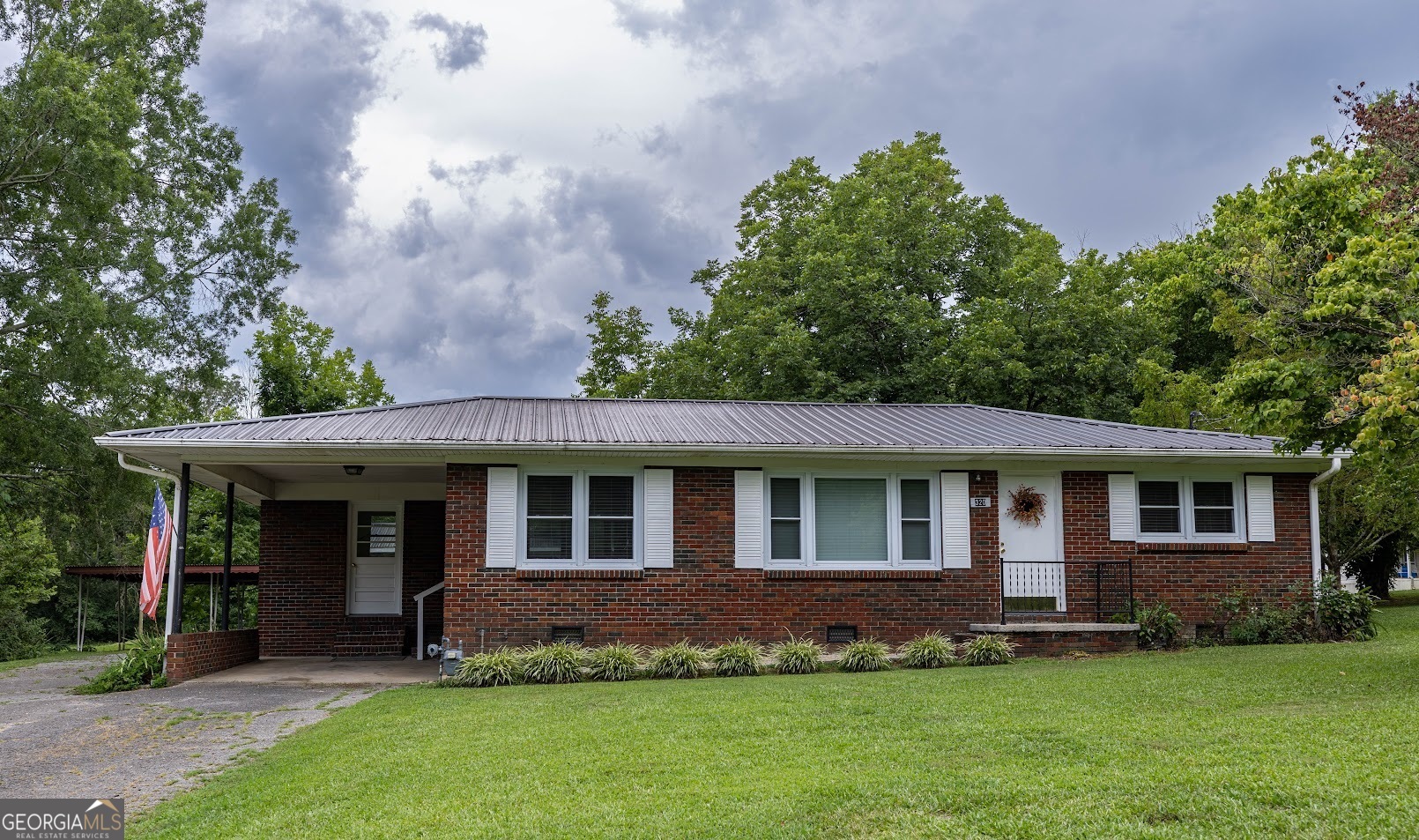 front view of a house with a yard