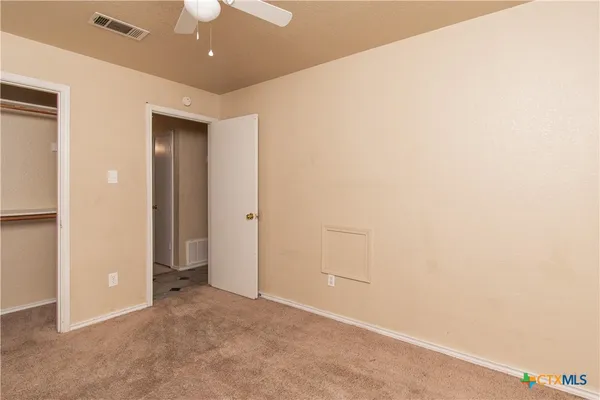 an empty room with a bathroom