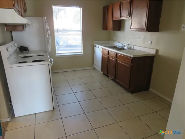 a view of a kitchen cabinets