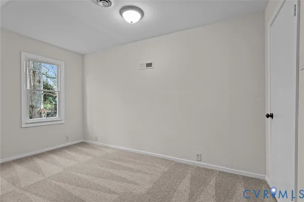 a view of an empty room and closet