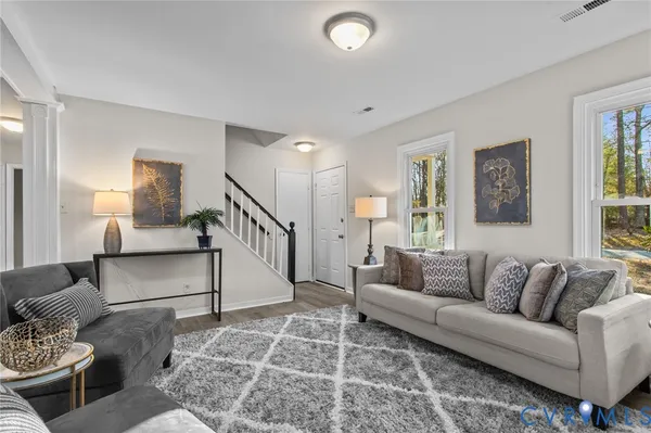 a living room with furniture and a rug