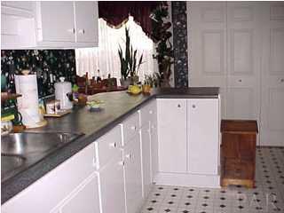 4 Brandywine Road Pensacola, FL 32507 - Photo 3 of 8 a kitchen with sink and cabinets