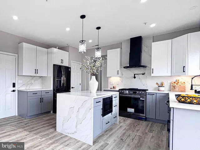 a spacious bedroom with a bed a couch and a window