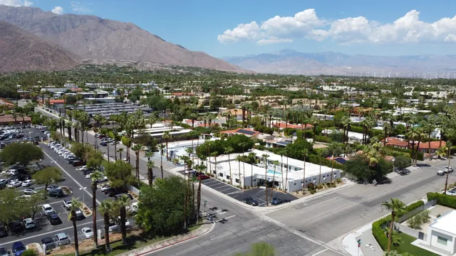 an aerial view of residential house and car parked