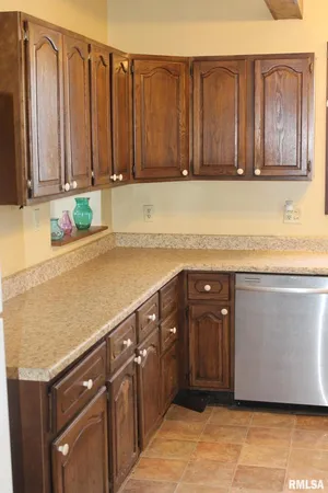 a kitchen with a sink stove and refrigerator