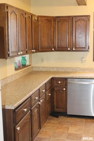 a kitchen with a sink stove and refrigerator