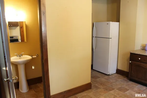 a view of entry way with wooden door