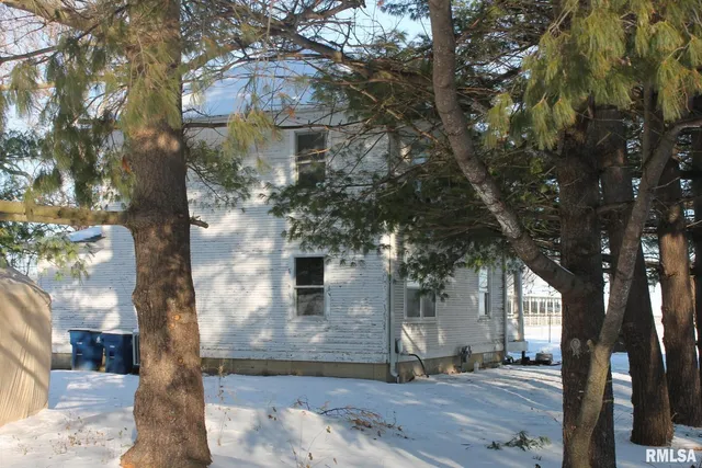 a front view of a house with yard