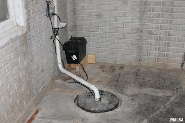 a bathroom with a shower and a sink