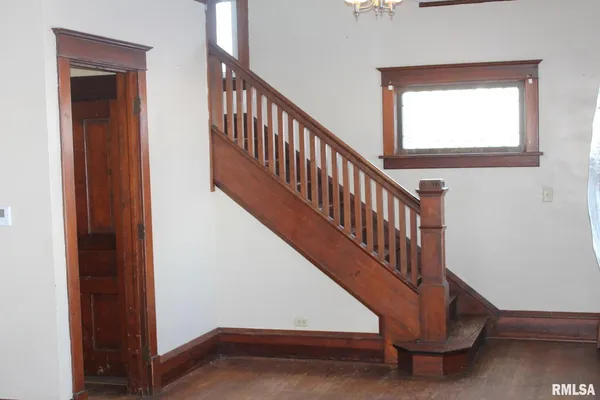 a view of entryway with wooden floor