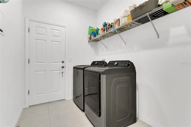 a utility room with dryer and washer