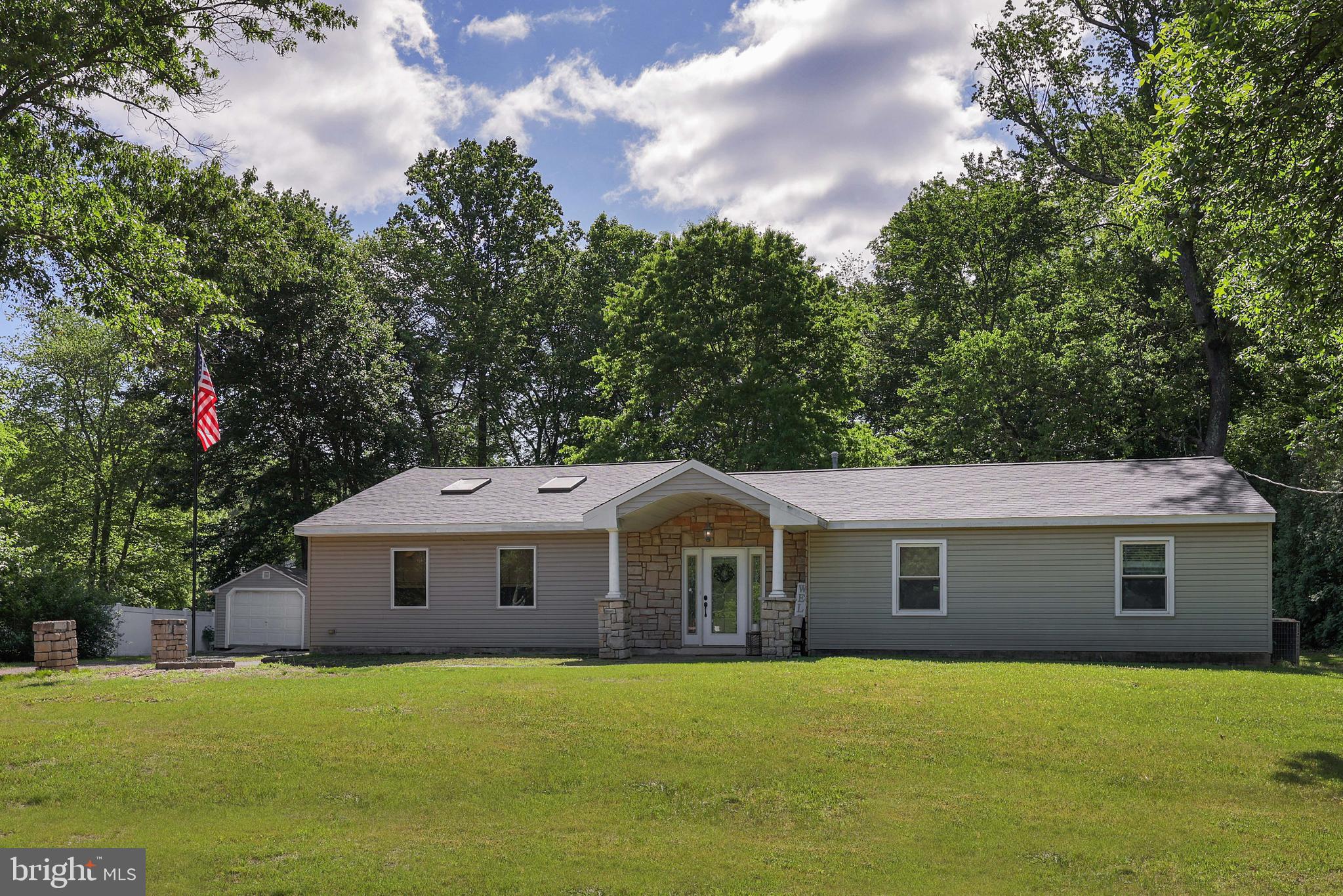390 East Millstream Road Cream Ridge, NJ 08514 - Photo 7 of 33 a front view of a house with a yard