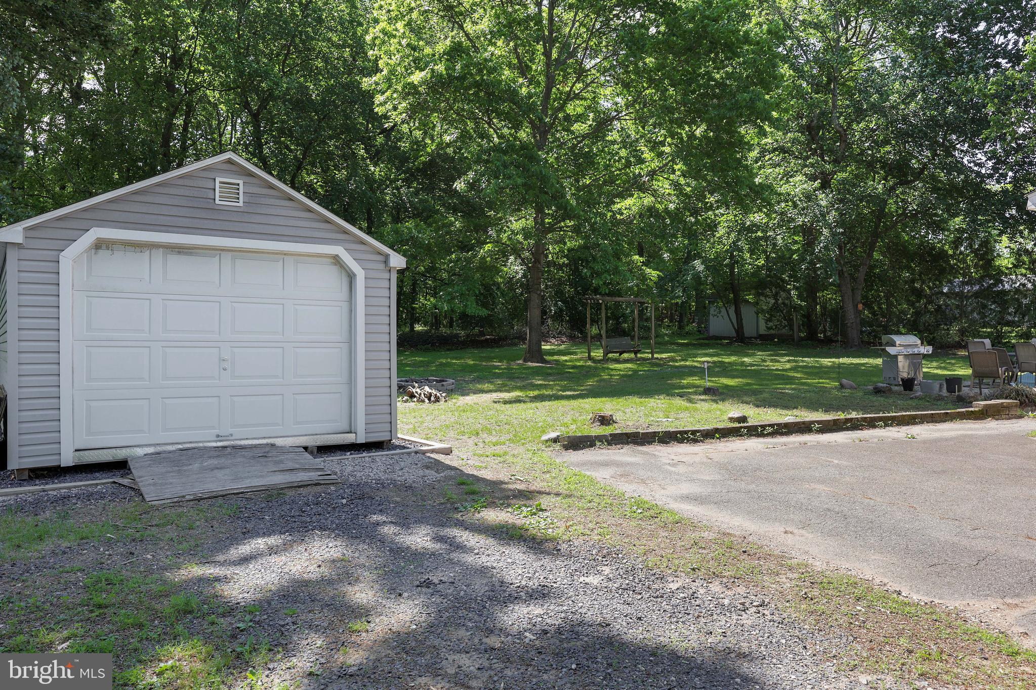390 East Millstream Road Cream Ridge, NJ 08514 - Photo 9 of 33 a front view of a house with a yard