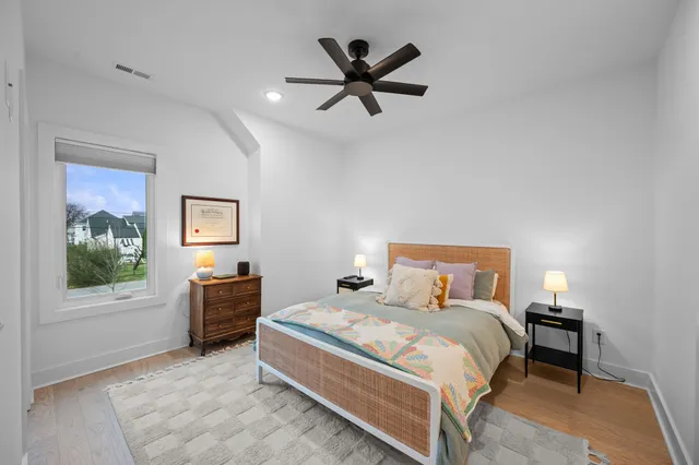 a bedroom with a bed and window