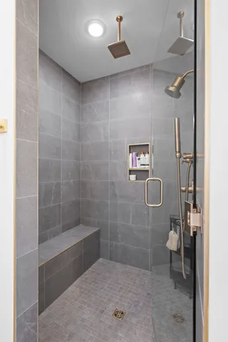 a bathroom with a shower and toilet