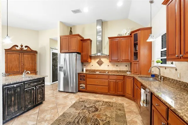 a spacious bathroom with a granite countertop sink and a bathtub