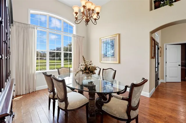 a utility room with lots of clutter and cabinets