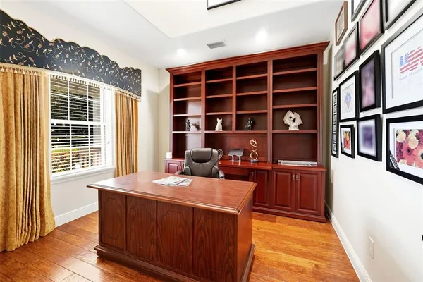 a living room with furniture a flat screen tv and a rug