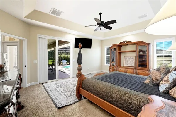 a large bathroom with a tub sink and mirror