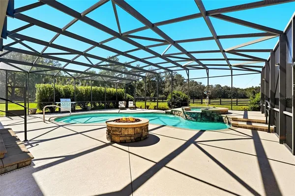 a view of a swimming pool with a patio