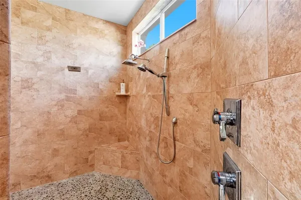 a view of storage and utility room with closet