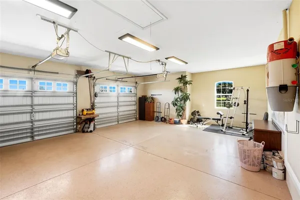 a view of a swimming pool with outdoor seating