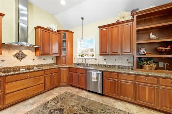 a spacious bathroom with a granite countertop sink and a bathtub