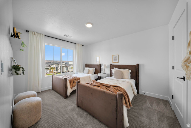 382 North Rhyolite Drive, Unit 111 Hurricane, UT 84737 - Photo 23 of 37 Bright room featuring neutral carpeting and white walls