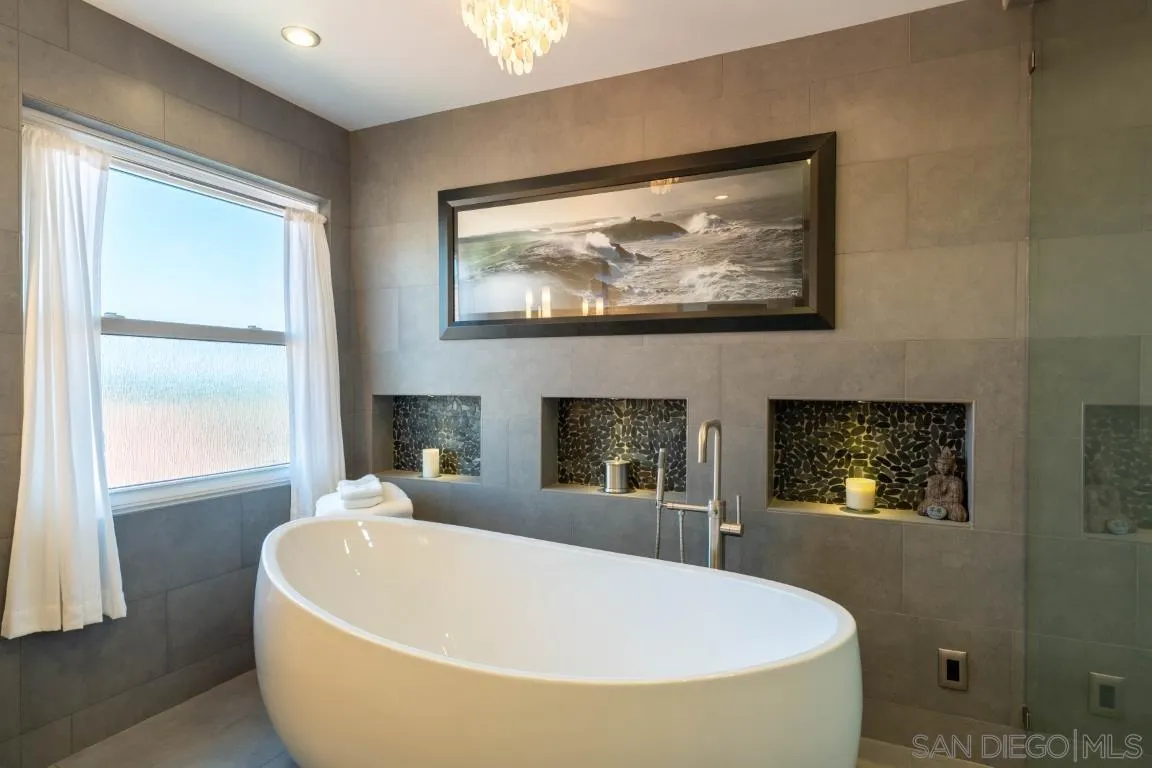 907 Ridge Heights Drive Fallbrook, CA 92028 - Photo 20 of 70 a white bath tub sitting in a bathroom next to a window