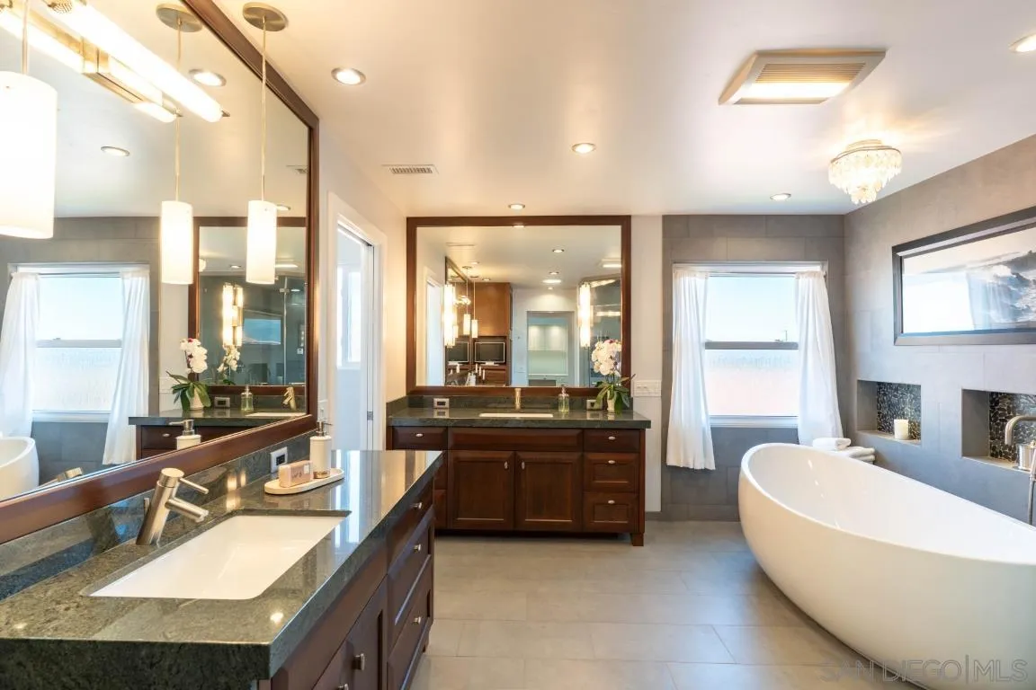 907 Ridge Heights Drive Fallbrook, CA 92028 - Photo 26 of 70 a spacious bathroom with a tub a sink double vanity and a large mirror