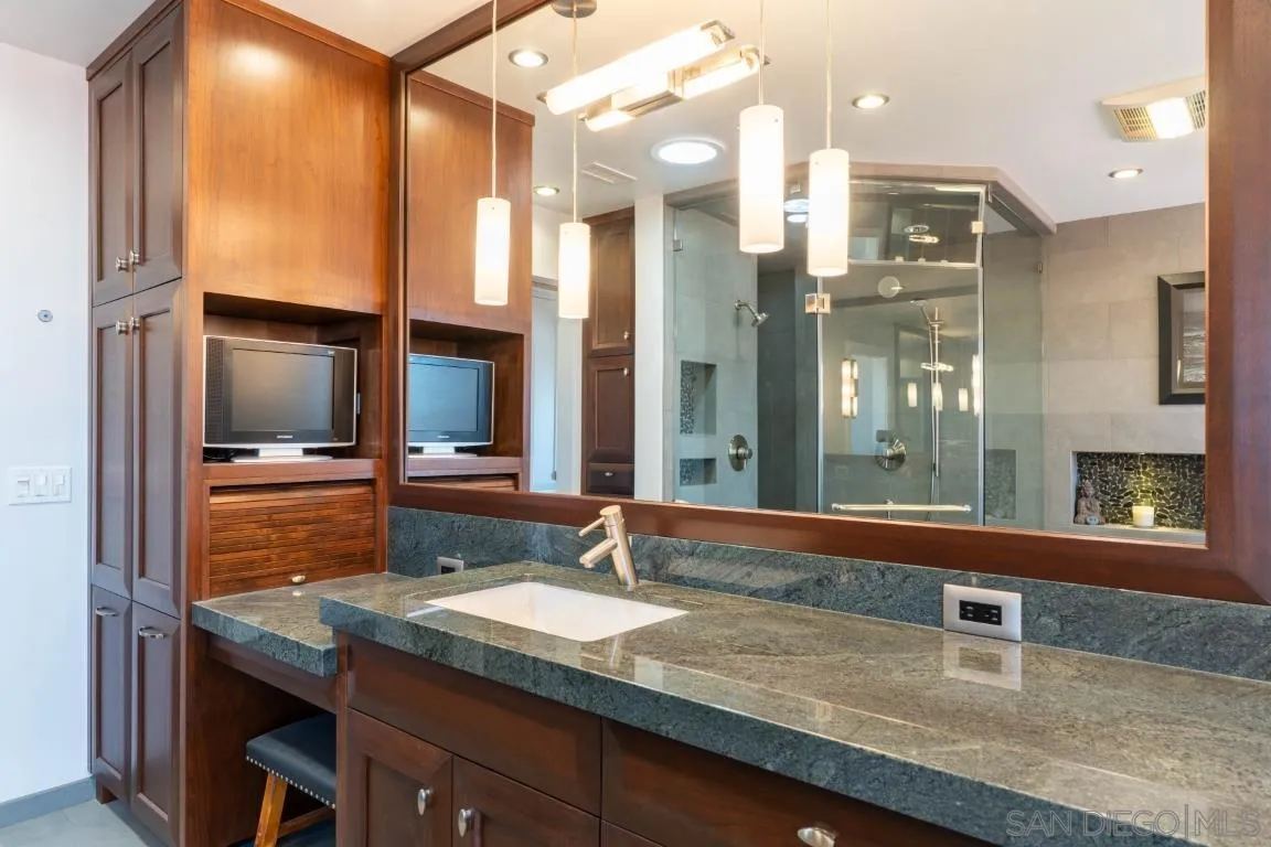 907 Ridge Heights Drive Fallbrook, CA 92028 - Photo 28 of 70 a bathroom with a granite countertop sink and a mirror