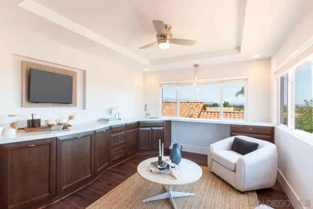 a view of a bathroom with a sink and mirror