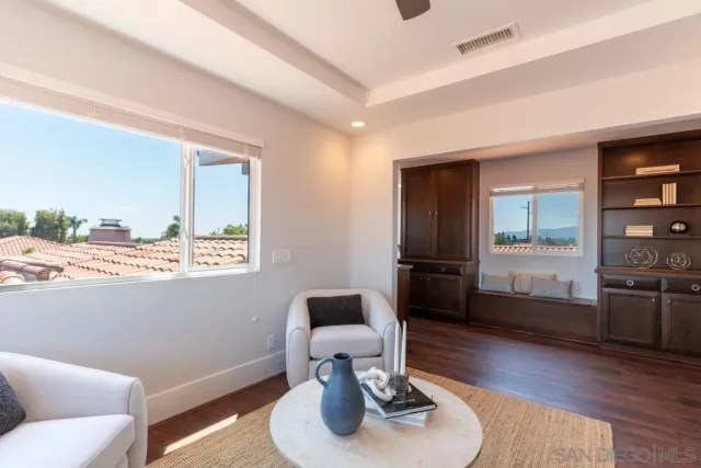 a view of balcony with deck and wooden floor