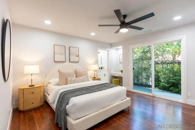 a view of a roof deck with wooden fence and a floor to ceiling window